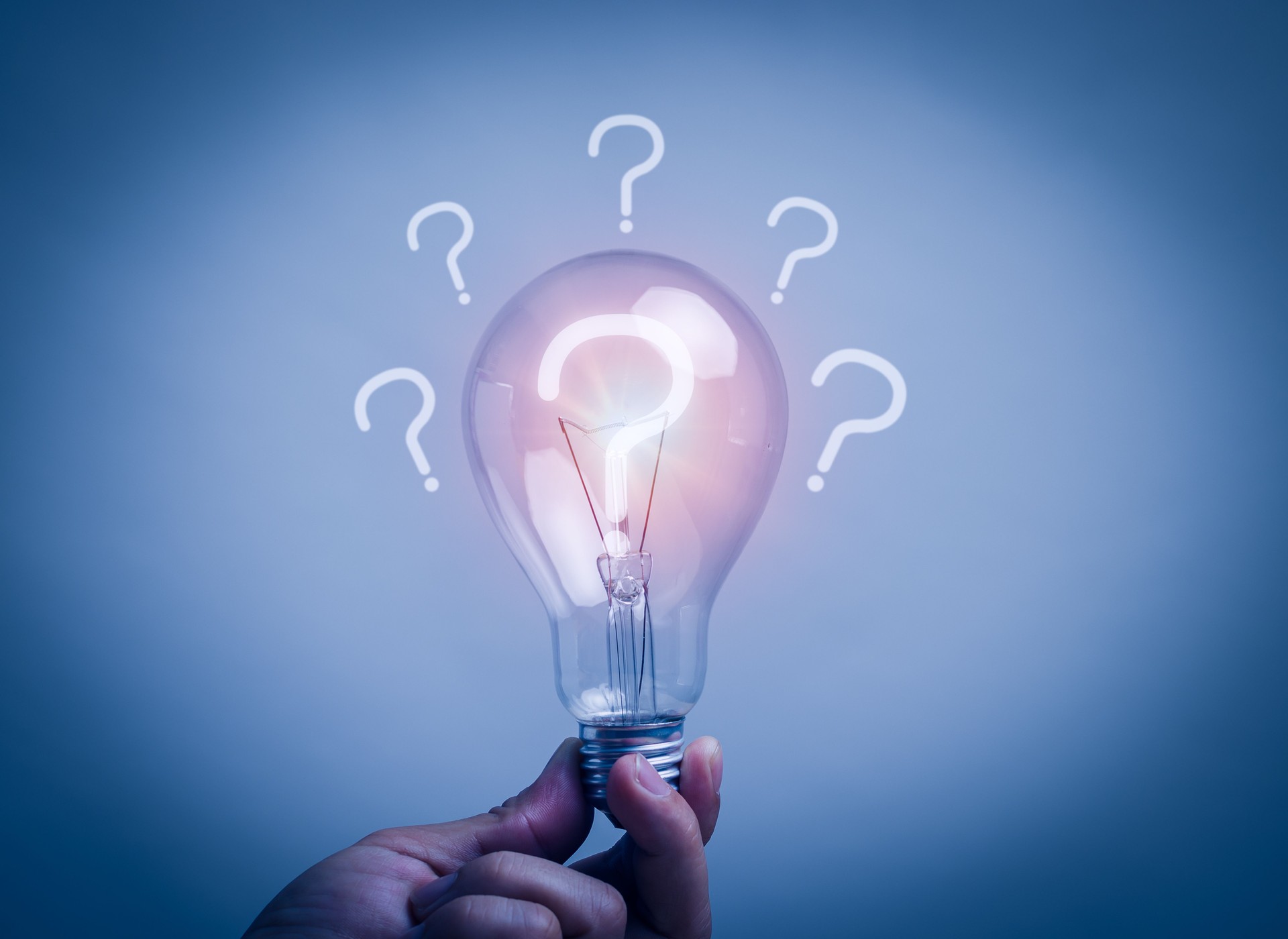 concept of problem analysis, creativity analytical thinking process Or find out the cause that happened during the process, hand holding  light bulb with the question mark inside